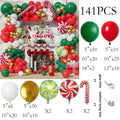 A festive Christmas balloon arch kit with red green white and gold balloons featuring candy cane and peppermint swirl designs