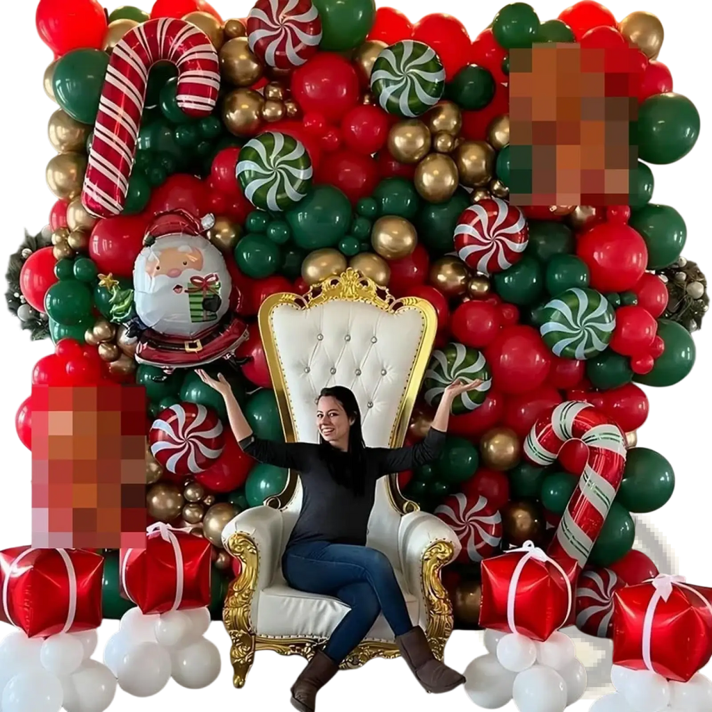 White throne chair with gold trim and tufted upholstery alongside red green gold candy cane balloon arch kit for christmas