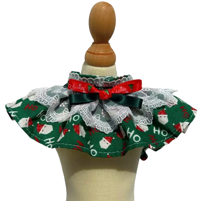 Christmas dog collar with green fabric, white lace trim, and a red ribbon bow for festive pet wear