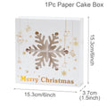 White paper gift box with gold snowflake cutout and festive merry christmas lettering for holiday cookie packaging