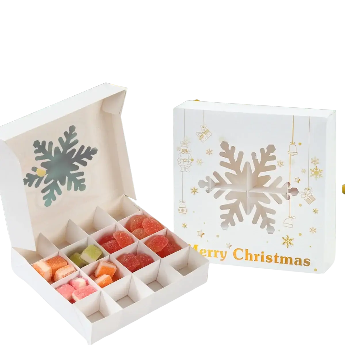 White christmas-themed paper gift box with snowflake design and gold accents containing colorful gummy candies