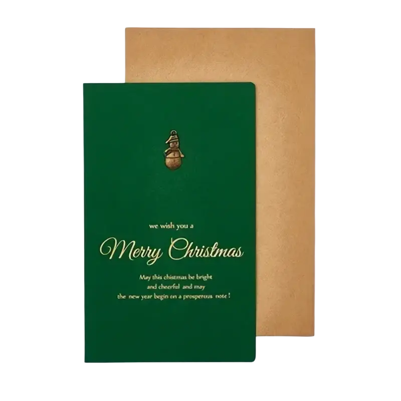 Deep green christmas greeting card with gold foil lettering and a small golden bell emblem in a set with gold foil envelopes