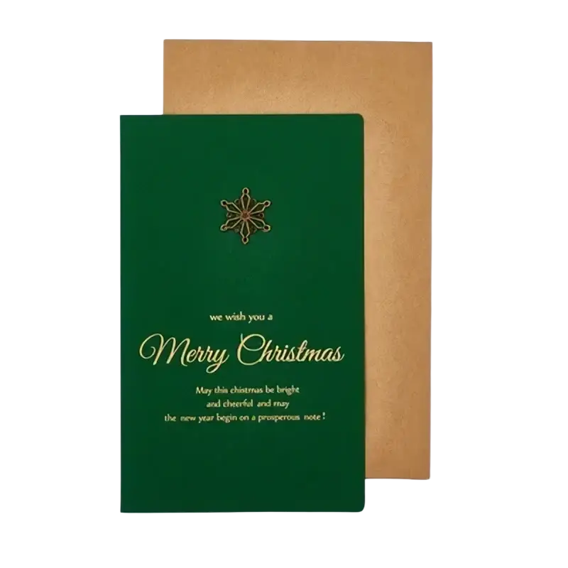 Deep green christmas greeting card with gold foil lettering and starburst design with textured brown envelope in set