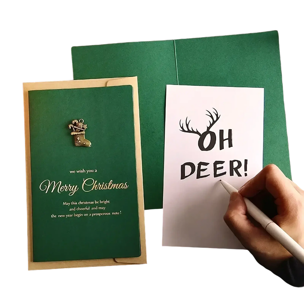 Green christmas greeting card with gold foil lettering and a metallic stocking pin paired with gold foil envelopes