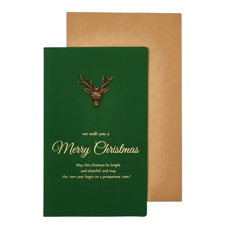 Green christmas greeting card with bronze reindeer pin and gold foil lettering in a set with gold foil envelopes