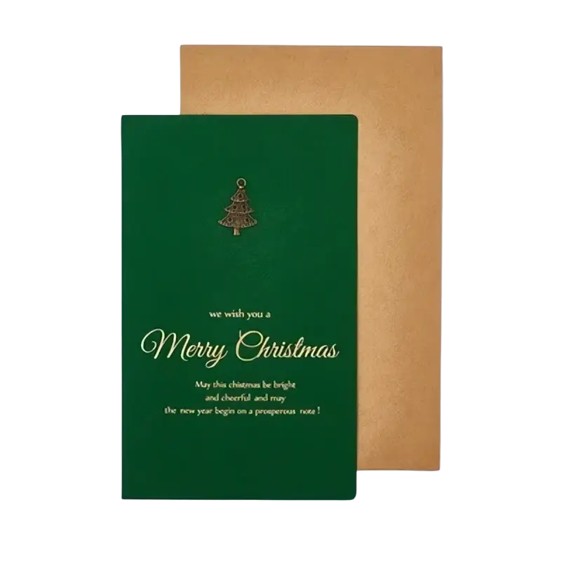 Green Christmas greeting card with gold foil lettering and tree design paired with brown textured envelope from set