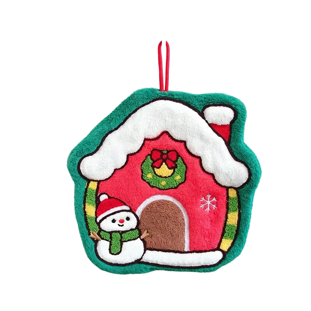Christmas hanging hand towel in coral fleece with a plush red house pot holder featuring an embroidered snowman design