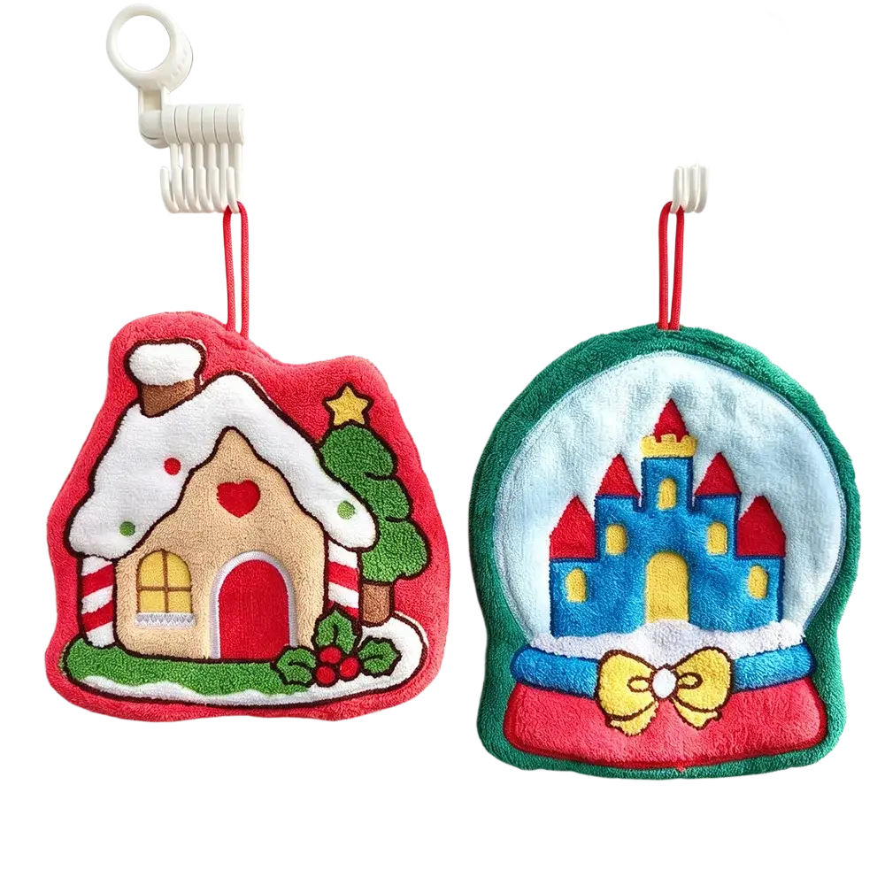 Two festive coral fleece christmas hanging hand towels shaped like a snow-covered gingerbread house and snow globe castle