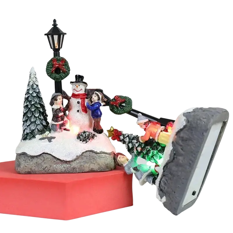 Christmas house light led snowman figurine display with children and festive decorations on snowy base with integrated lights