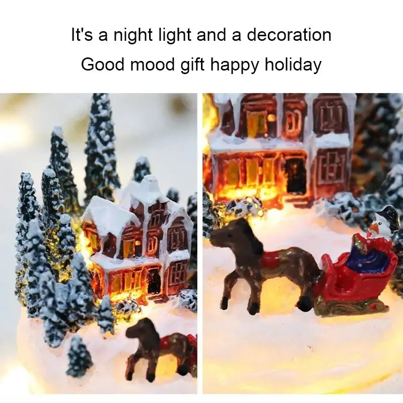 A christmas house night light featuring snow-covered houses with glowing windows and festive sleigh decor