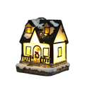 A warmly lit christmas house night light with black shingled roof, snow accents, glowing windows, and festive wreath decor