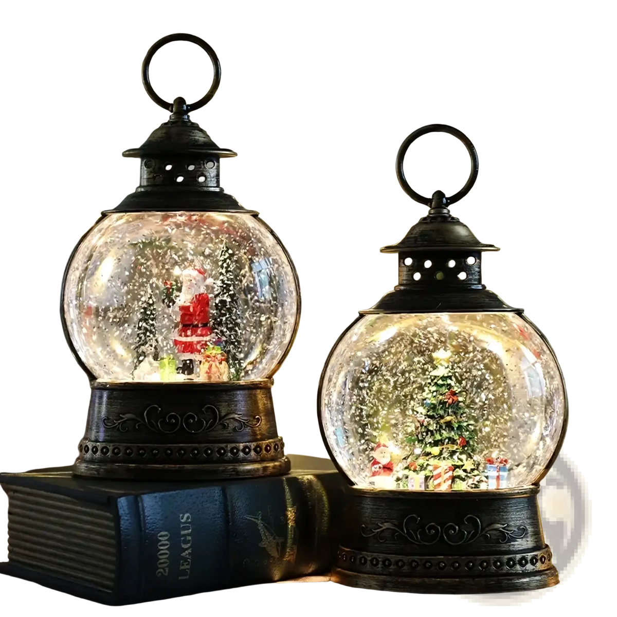 Two ornate black lantern-shaped snow globe music boxes with clear glass domes featuring santa and tree scenes