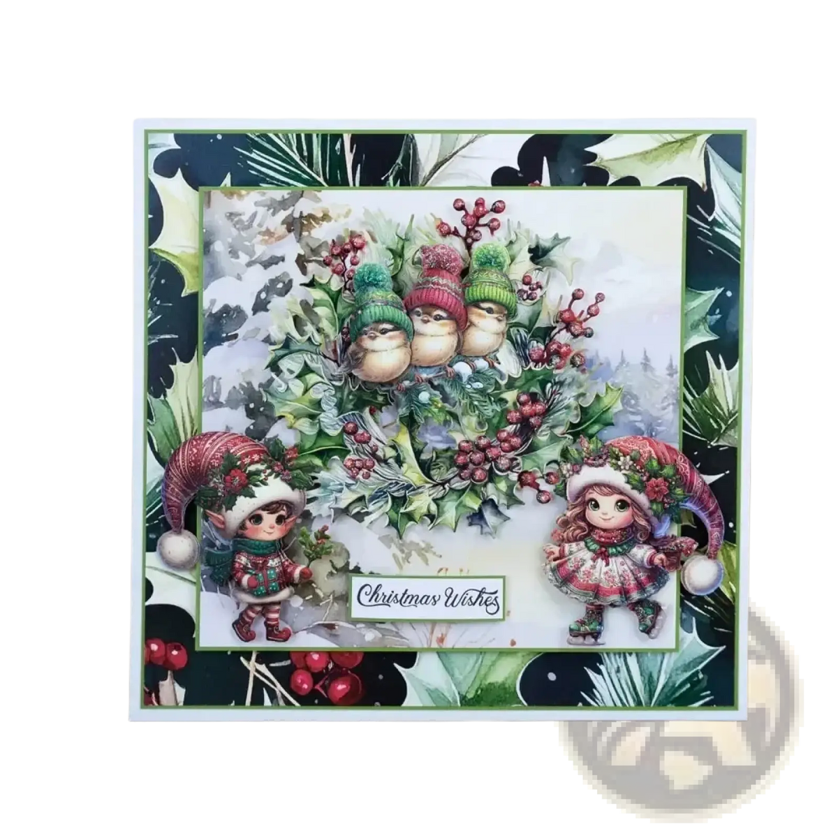 A christmas metal cutting die and stamp set featuring a festive card with elves and birds in a holly wreath design