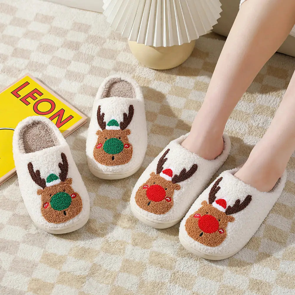 White plush reindeer plush christmas slippers with cozy faux fur featuring embroidered faces with antlers and hats