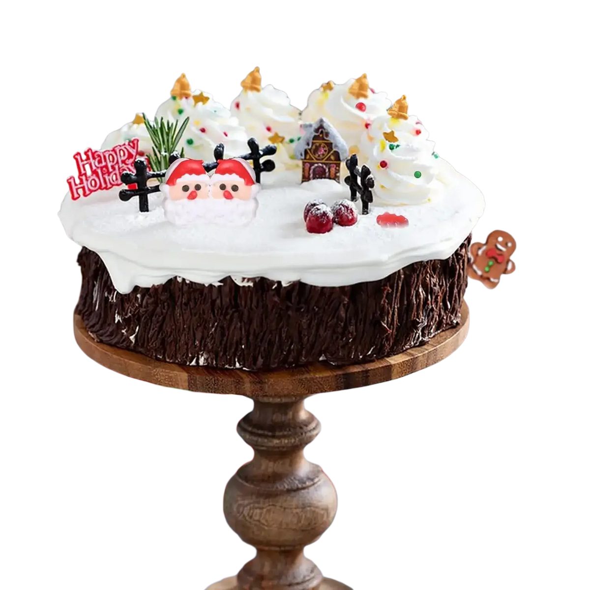 A festive chocolate cake with white frosting decorated with santa figurines and gingerbread house Christmas sprinkles mix