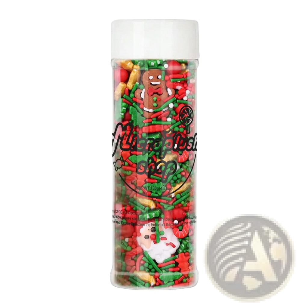 A festive holiday sprinkle jar filled with red green and gold christmas-themed decorations for baking