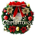 A festive green christmas wreath with a red velvet bow gold and red flowers and merry christmas wood lettering holiday decor
