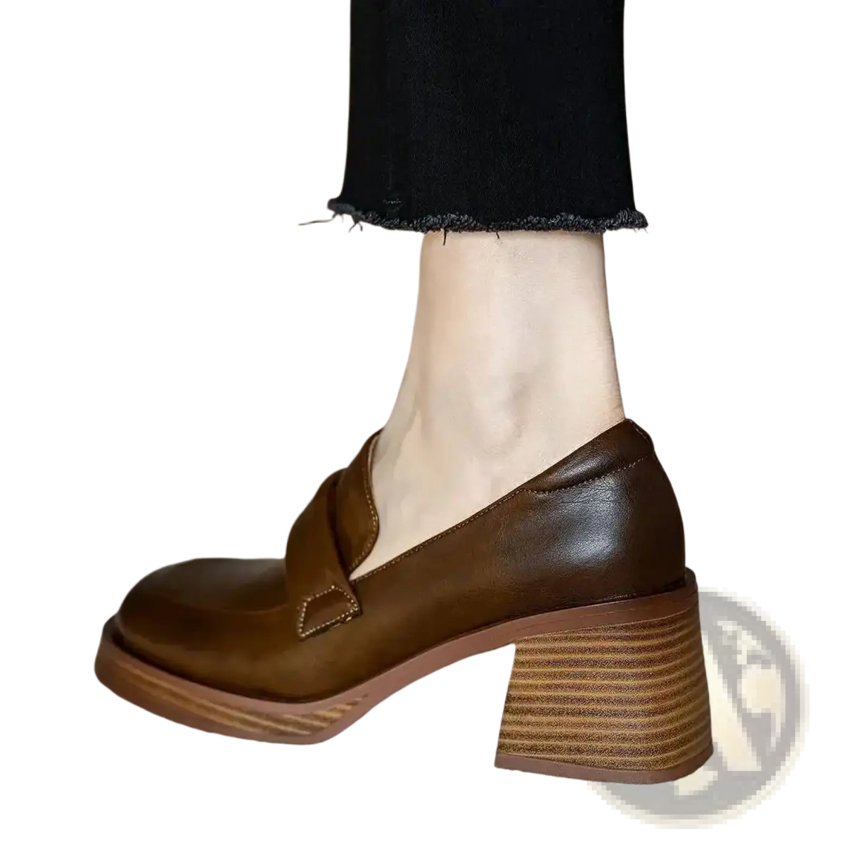 Brown leather chunky heel loafer with a stacked heel and single strap across the vamp for stylish wear