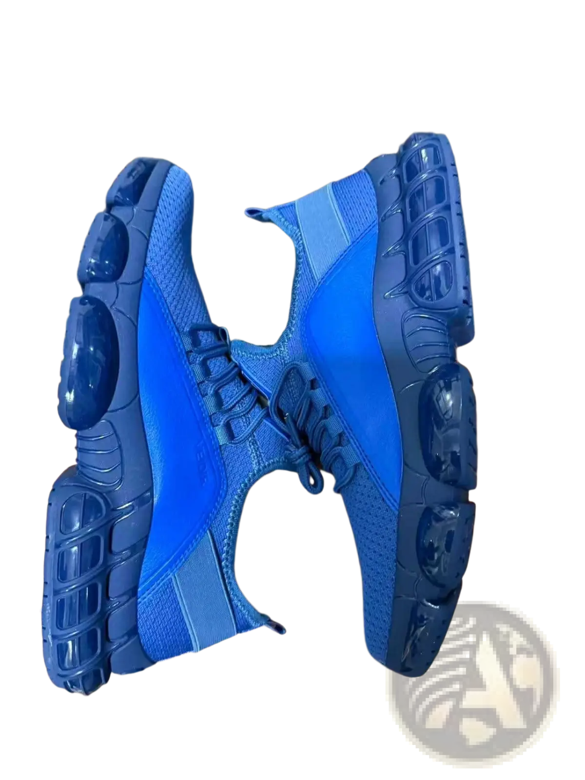 Vibrant blue chunky mesh running sneakers with breathable mesh upper and translucent rubber soles with air cushioning pods