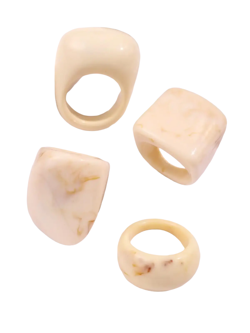 Chunky resin cocktail rings 4-piece set in cream color with smooth glossy finish and organic irregular shapes