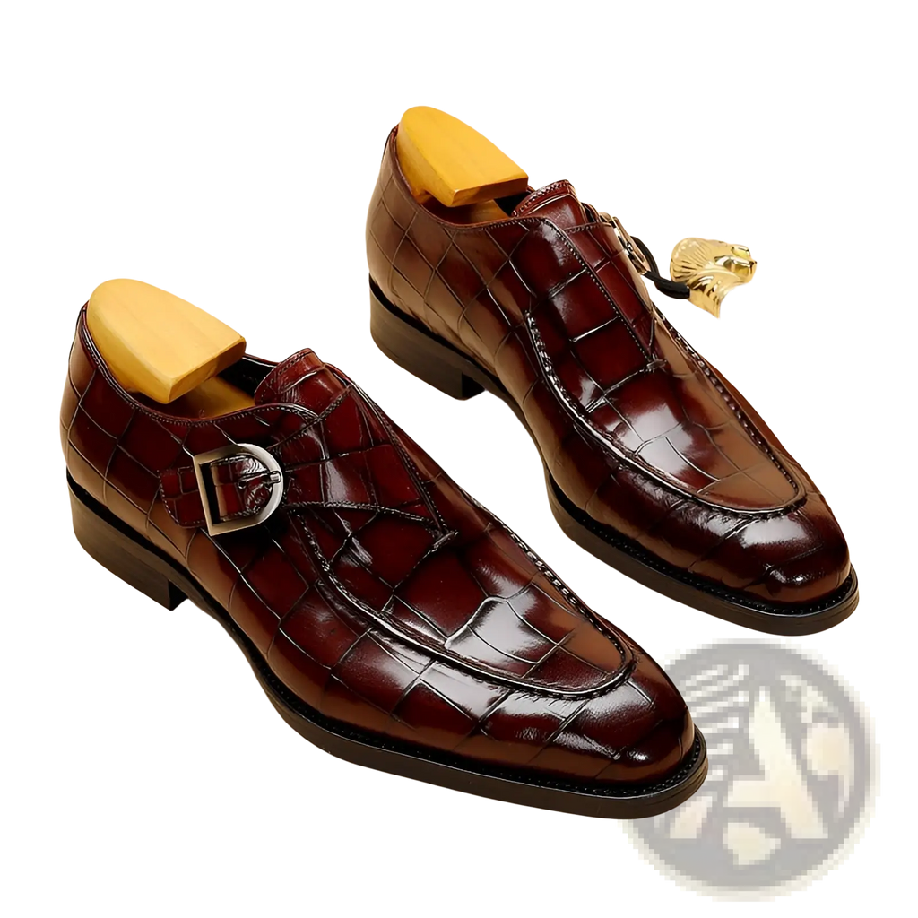 Classic men’s leather formal dress loafers in burgundy crocodile-embossed leather with silver monk strap buckle