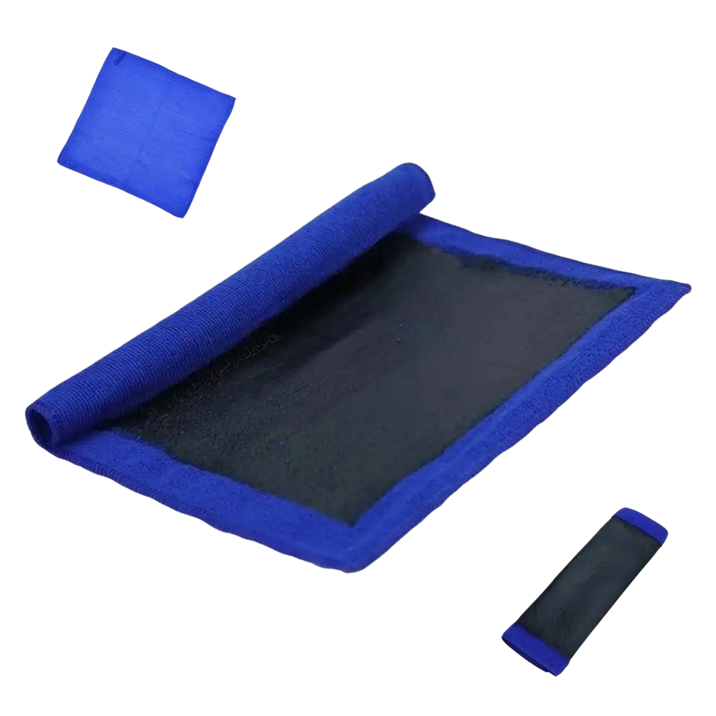 Blue clay bar towel with textured fabric and black mesh center partially rolled in compact carrying case for car detailing