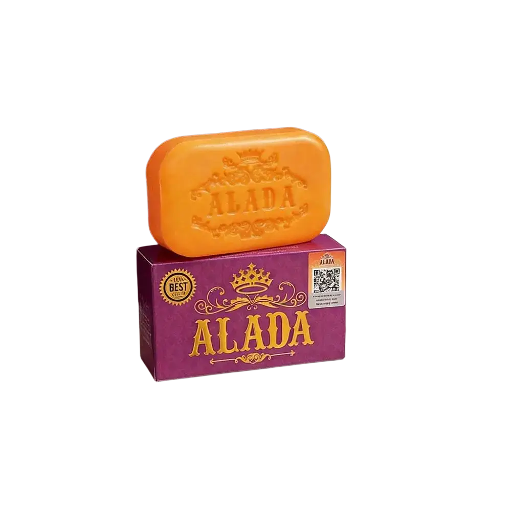 Orange alada cleansing soap bar with embossed crown on purple packaging for skin feeling bright and hydrated