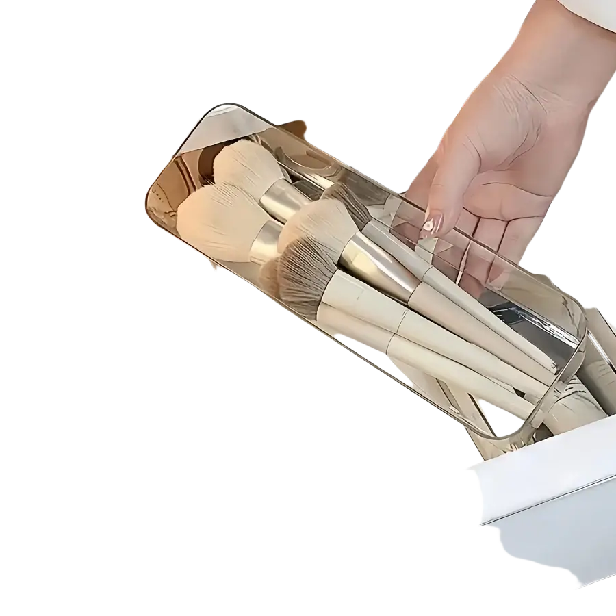 Clear plastic drawer organizer set holding beige and silver-tipped brushes for organizing makeup and office supplies