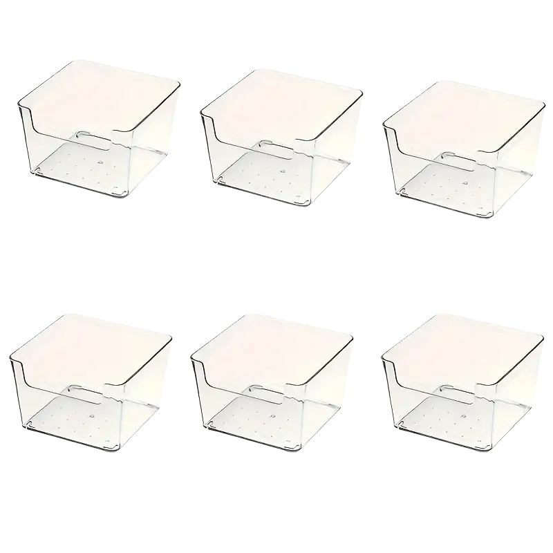 Clear plastic makeup organizer with square storage bins and integrated handles for drawer storage