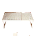 White plastic expandable cabinet shelf with grid pattern and adjustable height for closet shelf organization