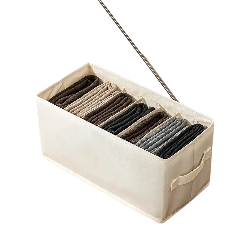 Beige fabric clothes storage box with seven compartments neatly organizing gray and black socks for wardrobe and jeans storage