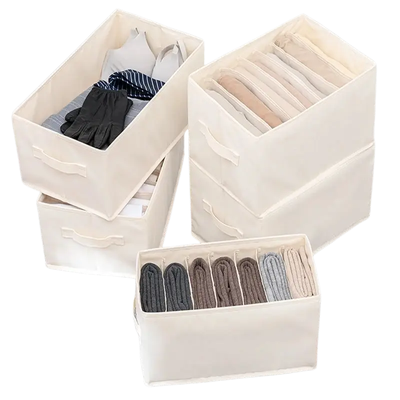Off-white fabric clothes storage box with handles and internal dividers for organizing folded wardrobe clothing and jeans