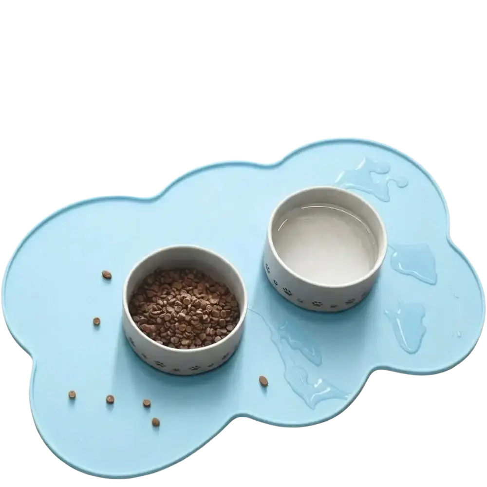 Light blue cloud silicone pet feeding mat with two white ceramic paw print bowls for small medium dogs and cats