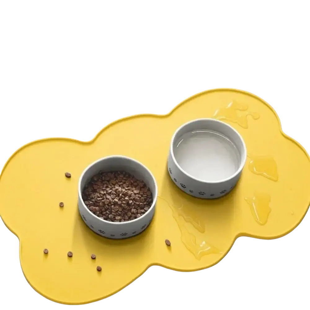 Yellow cloud-shaped silicone pet feeding mat with two gray paw print bowls for small and medium dogs and cats