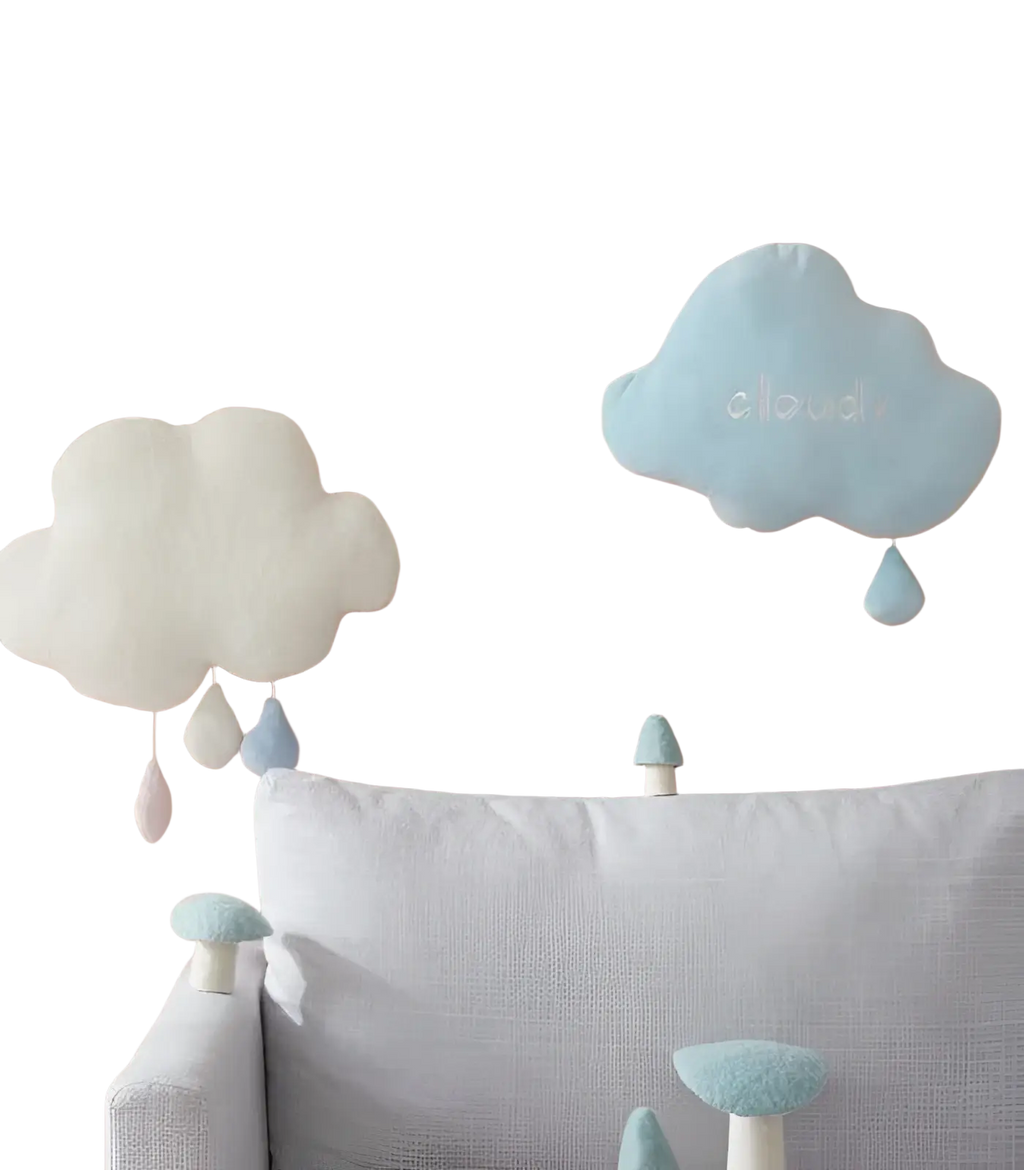 Soft pastel blue cloud-shaped plush wall hanging decor with embroidered word cloud and dangling raindrop accents