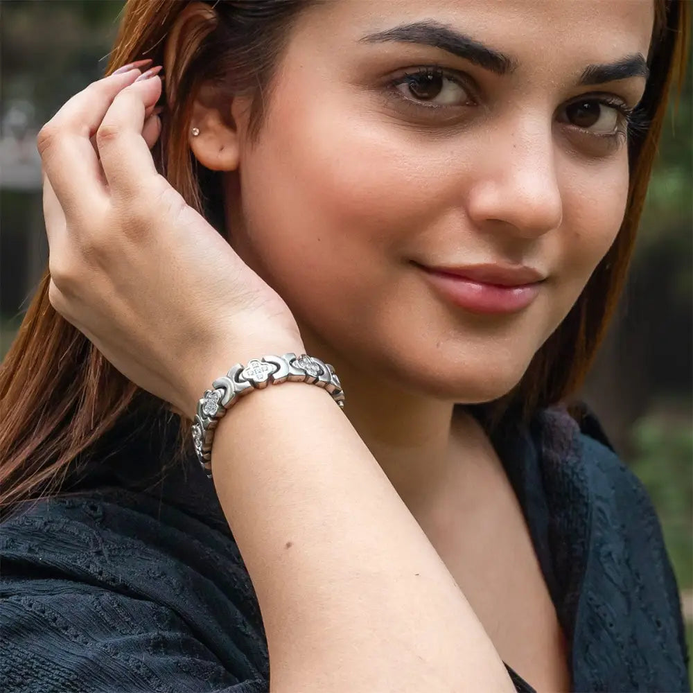 Silver clover crystal magnetic bracelet featuring silver-toned floral design with clear stones and neodymium magnets