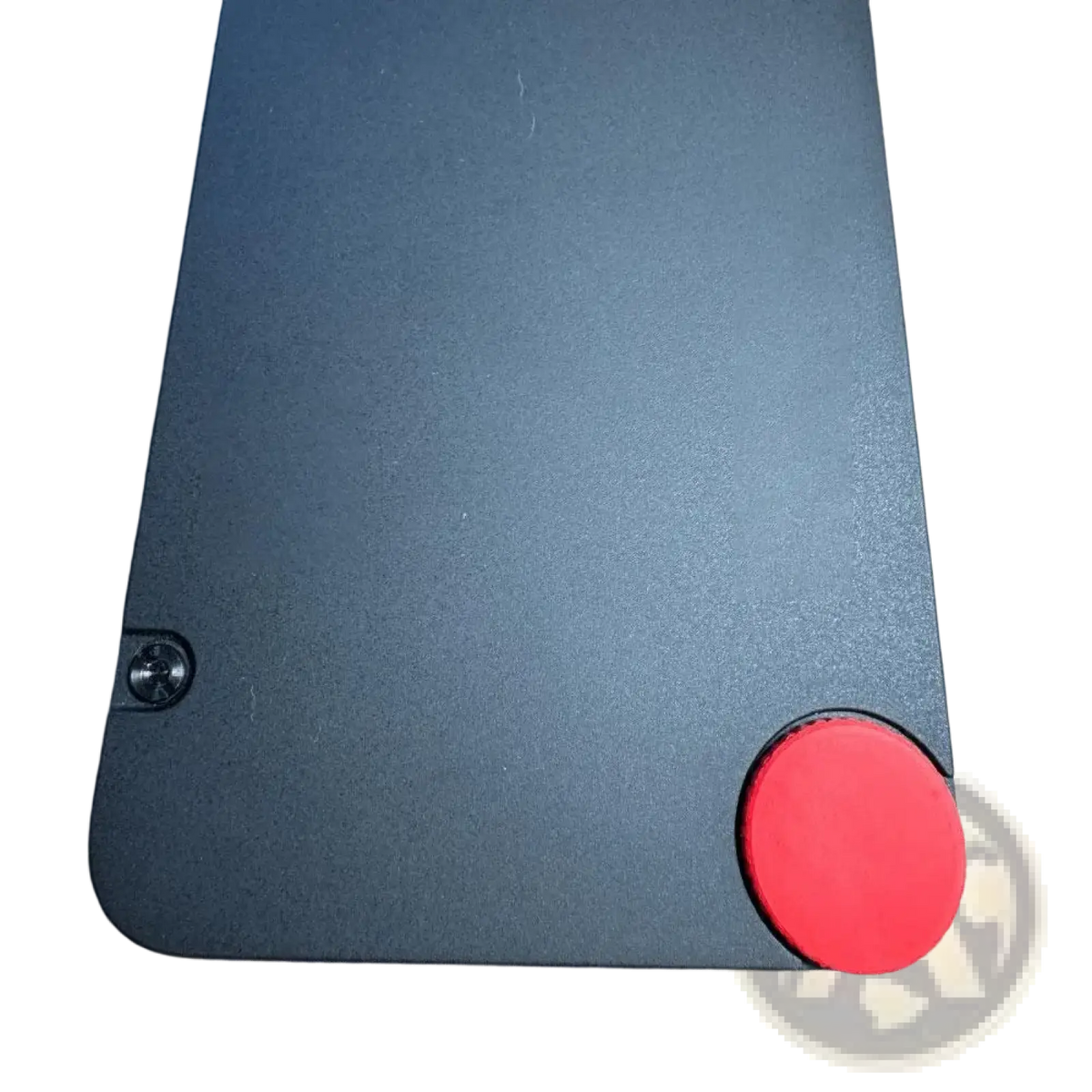 Black lenovo thinkpad laptop with red circular cmf phone 1 replacement screw cap custom accent on bottom right corner