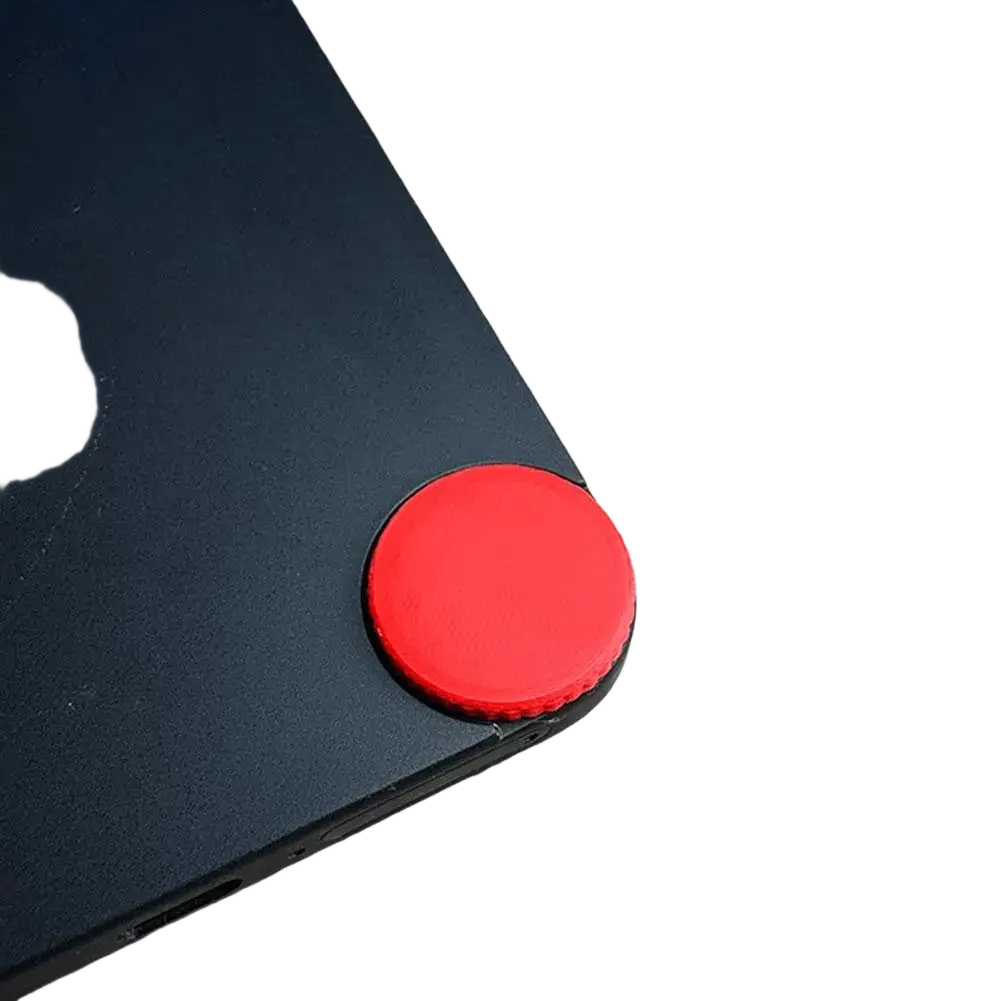 Red circular matte finish cmf phone 1 replacement screw cap custom accent designed to grip the edge of a black device