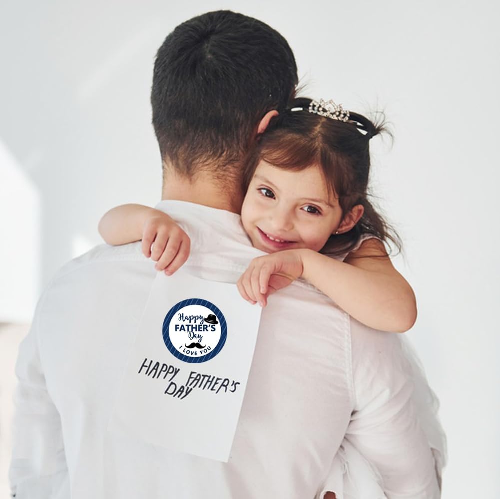 The back of a white cotton shirt features a circular blue and white happy fathers day graphic, related to a Fathers Day gift stickers roll.