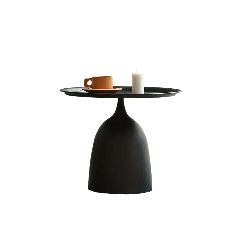 Black matte finished modern coffee table with sleek bulbous base and round top for living room use