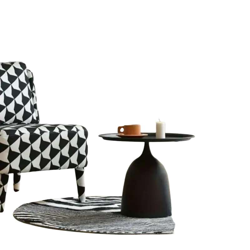 Black matte coffee table with a sleek bulbous base and round top for modern living room use