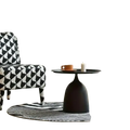 Black matte coffee table with a sleek bulbous base and round top for modern living room use
