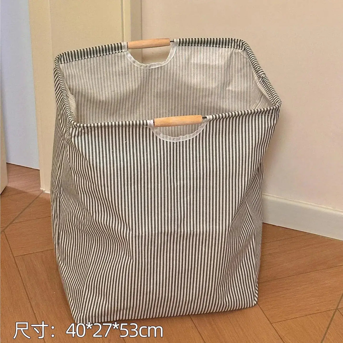 Collapsible canvas laundry basket ropa sucia with striped fabric, wooden handles, and white interior for efficient storage