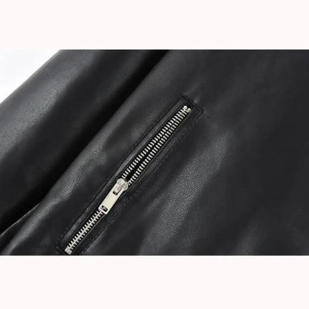 Women’s colorblock loose fit pu leather biker jacket in black faux leather with a silver zipper front closure
