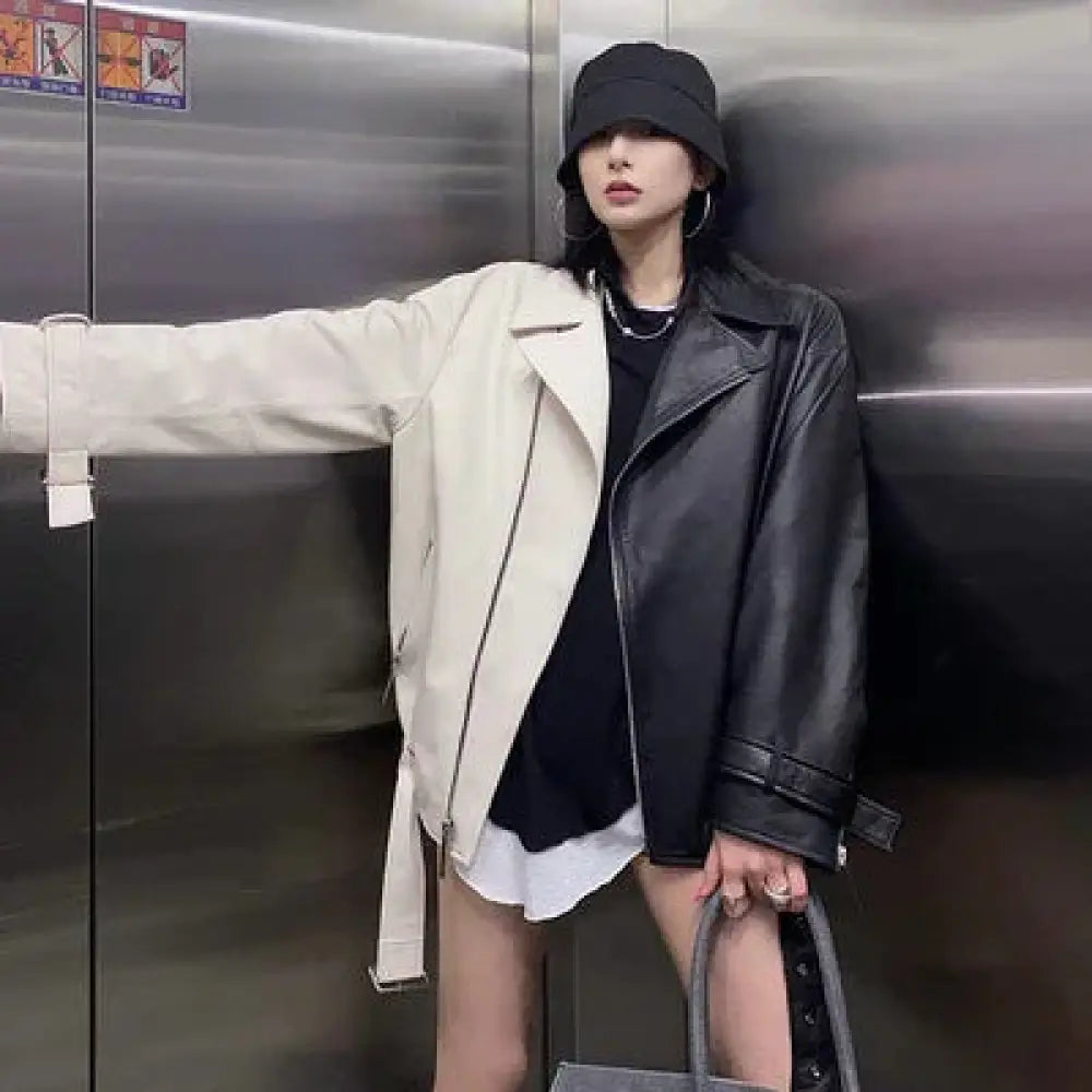 Women’s black colorblock loose fit pu leather biker jacket with matte finish and silver zipper details