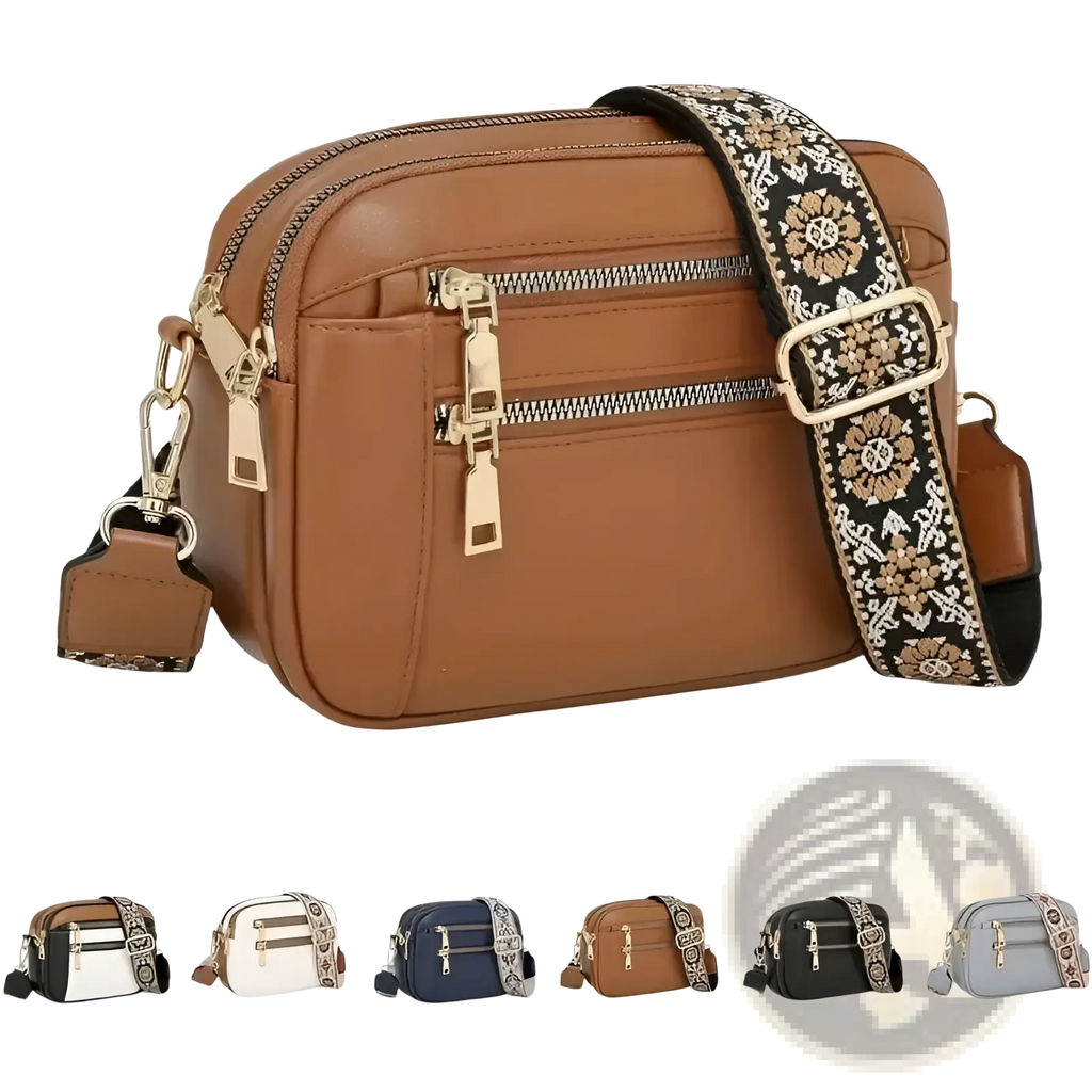 Brown colorblock leather crossbody bag with gold-tone zippers and a decorative floral-patterned strap