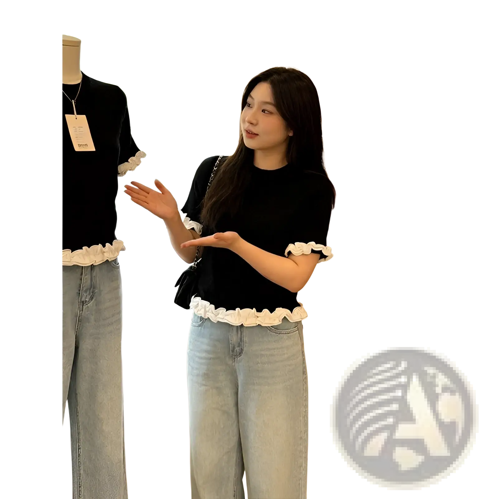 Black short sleeve knit top with white ruffled trim at hem and cuffs featuring colorblock design