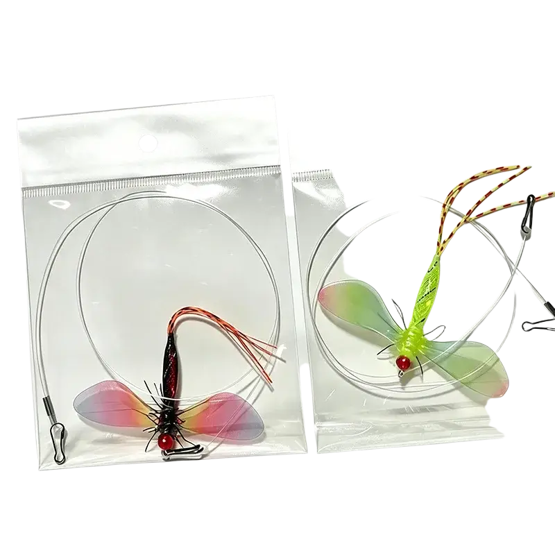Two colorful translucent fly fishing lures with detailed wings and red bead eyes in clear plastic bags for replacement use