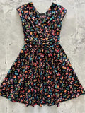 A black cotton greta colorful butterfly print dress with short sleeves and fitted waist in vibrant multicolored butterflies