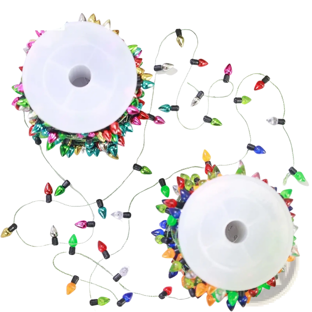 Colorful christmas garland string lights with vibrant metallic red green blue pink and gold bulbs for festive decoration